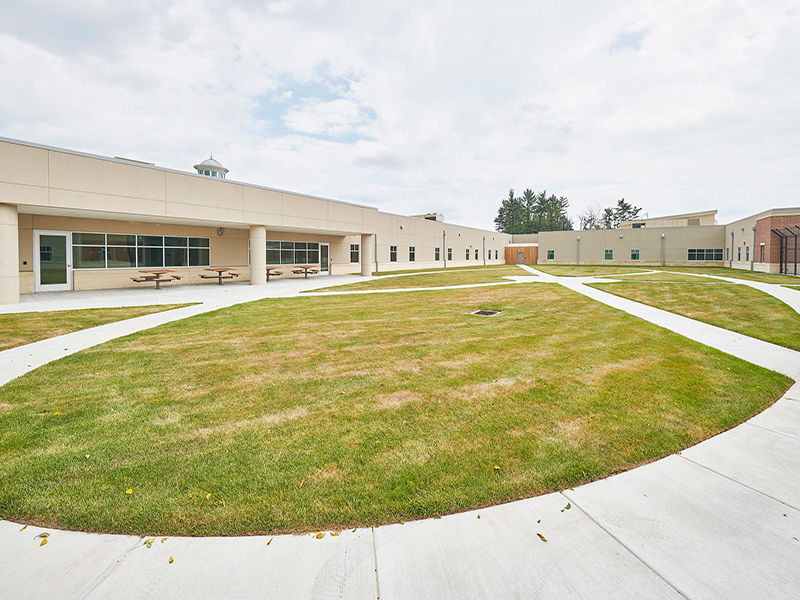 An open, grassy courtyard at Tower Behavioral Health